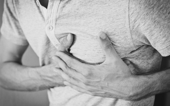 man holding his chest