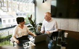 man and woman sharing ideas