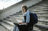 A student completes the FAFSA on a laptop. Beginning April 