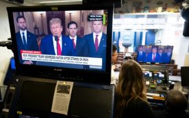 US President Donald Trump's address to the nation is seen in the White House briefing room